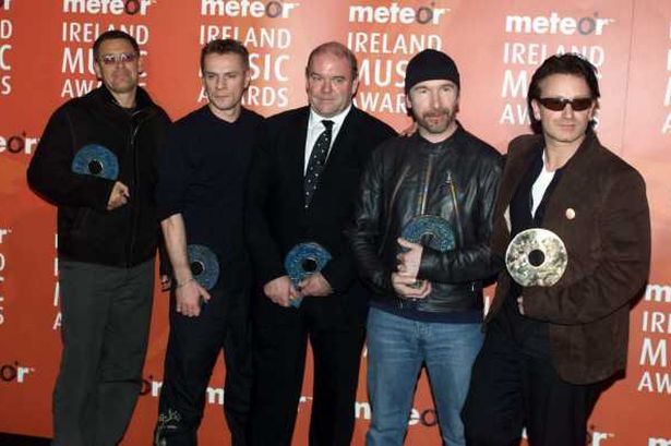  U2 with manager Paul Mc Guinness. Click for Paul's Wikipedia page to learn more. 