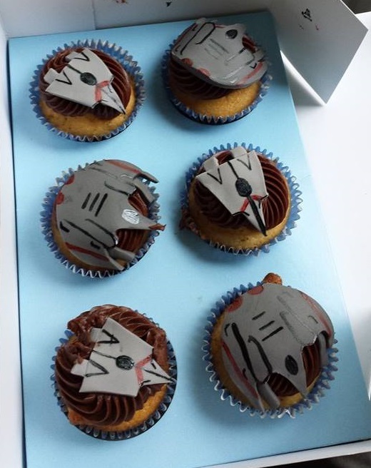 Claire's anniversary present to me with my game's spaceships on them! That's what support looks like. If you're wondering, support tastes like cupcakes.