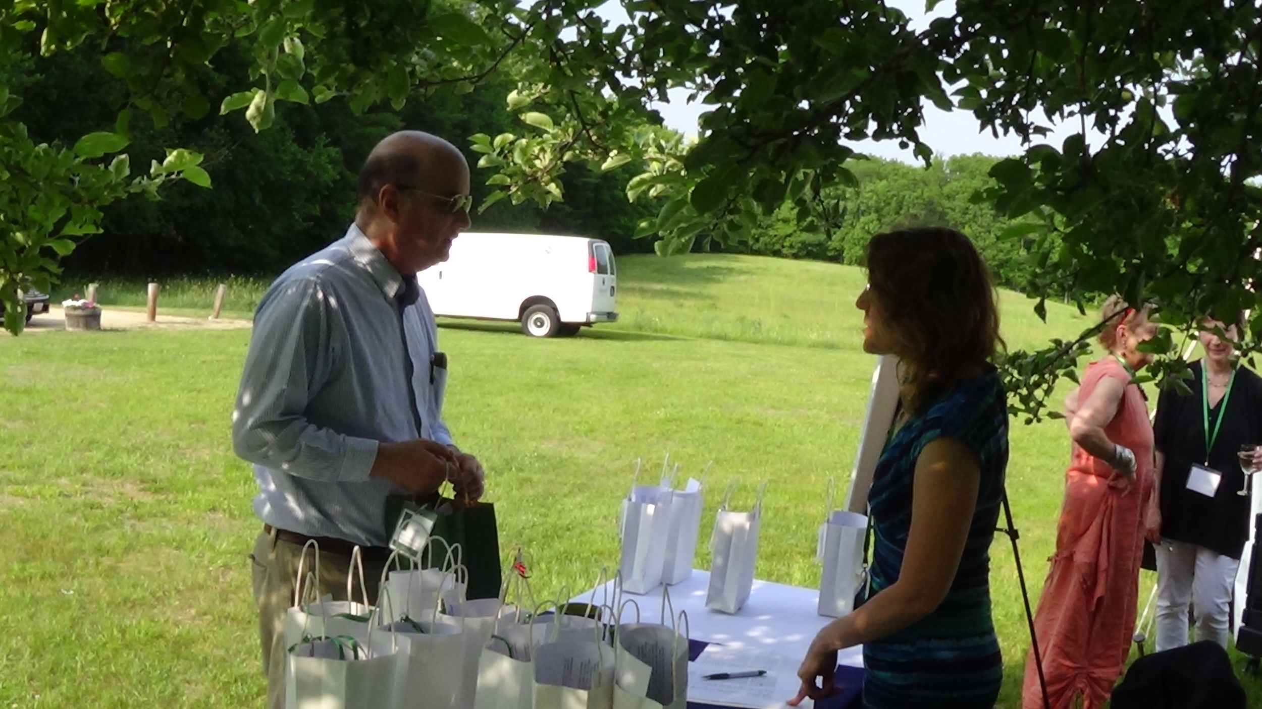 Instructor A.M. Juster registers with Hyla Brook Poet Rhonda Woodward