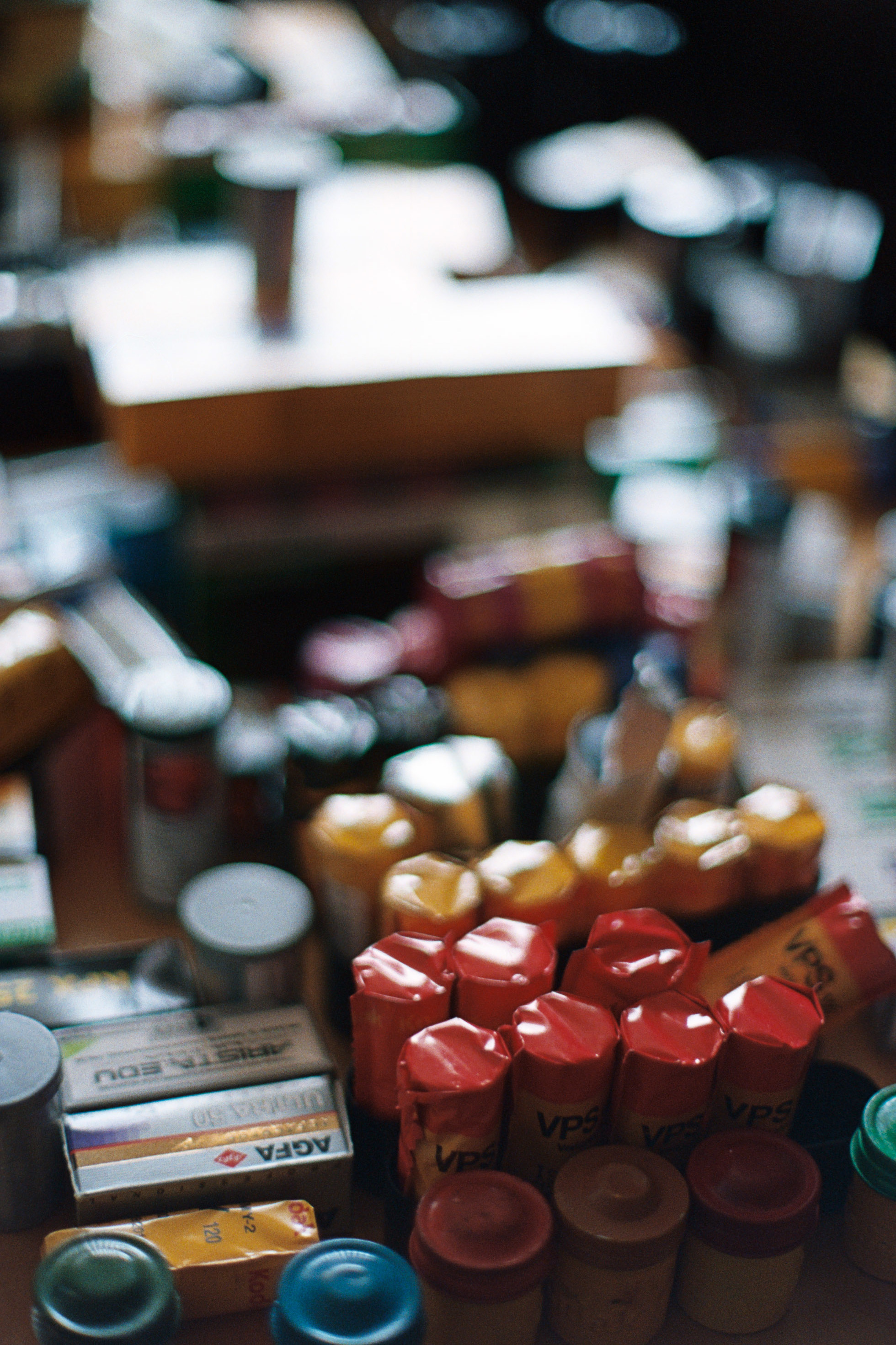 Coffee table stacked with various film stocks - heaven! | Nikon FM3A + Nikkor 50/1.2 | Lomography Color 800