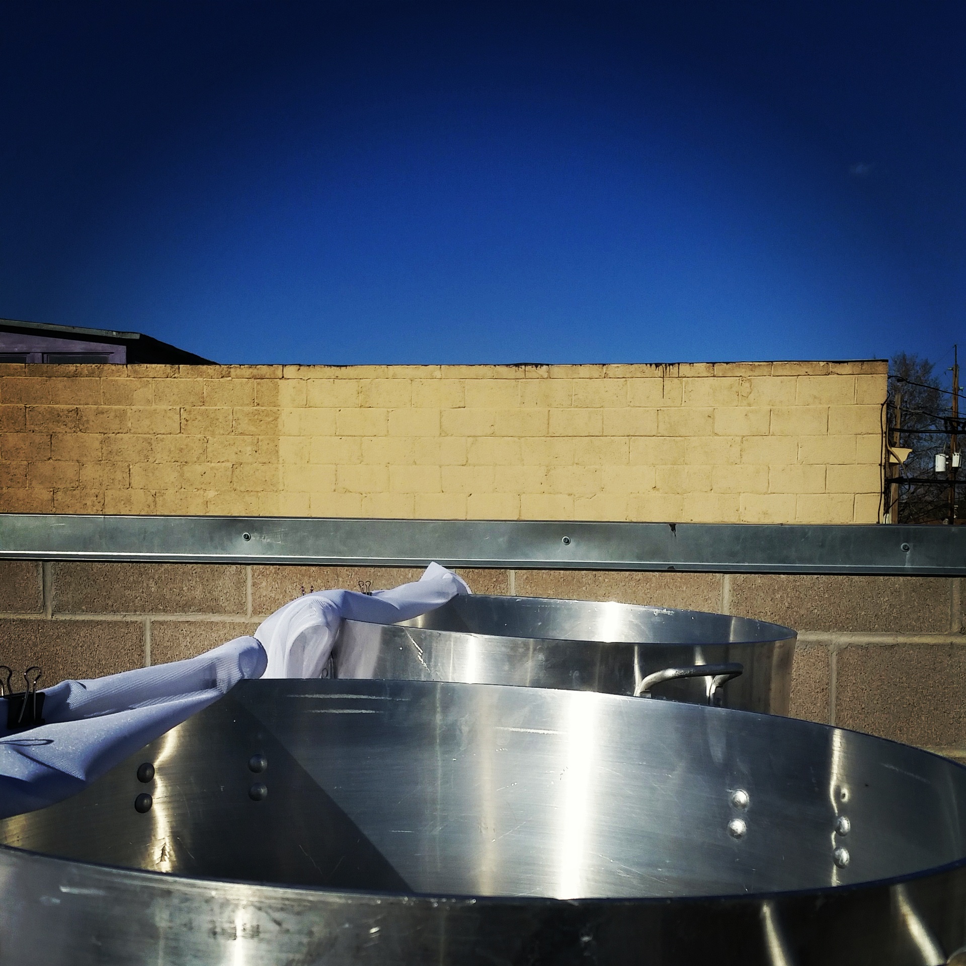 Our 120gal coolship isn't traditional, at all. Depending on batch size, we don't meet the traditional "Belgian rules" for wort depth. However, we've done extensive research and experimentation and settled on this system. It allows us to closely match the cooling rates and surface area to volume ratios of successful spontaneous ale producers around the world. We feel those factors are key to getting great inoculations.