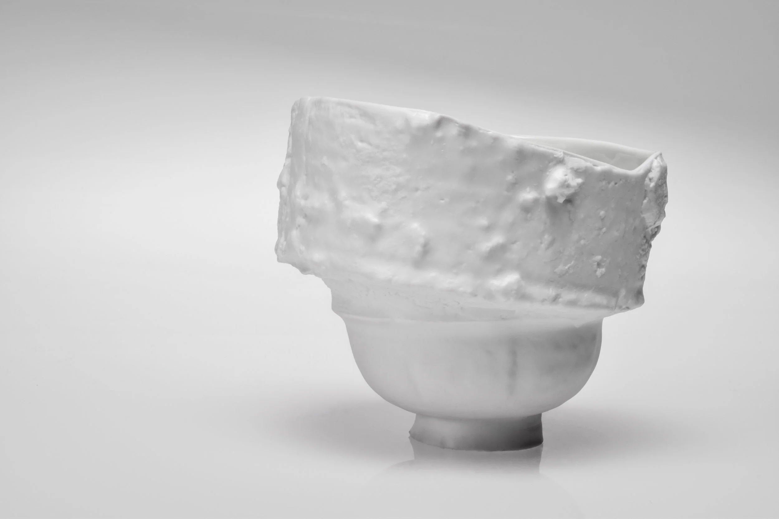 Saggar | Form Series , Jindezhen Porcelain with Glaze. 2017 - on going Ming Dynasty collapsed saggar and porcelain forms were collected from various sites around Jingdezhen, China, and moved through the mold making process; cast as thin porcelain versions of their former selves. Shifting form to surface, these objects touch lightly towards ideas related to dislocation, longing, and the inescapable potential of the cast off. Collapsing time and place, their glazed interiors seek to reanimate the objects as functional vessels of the present.