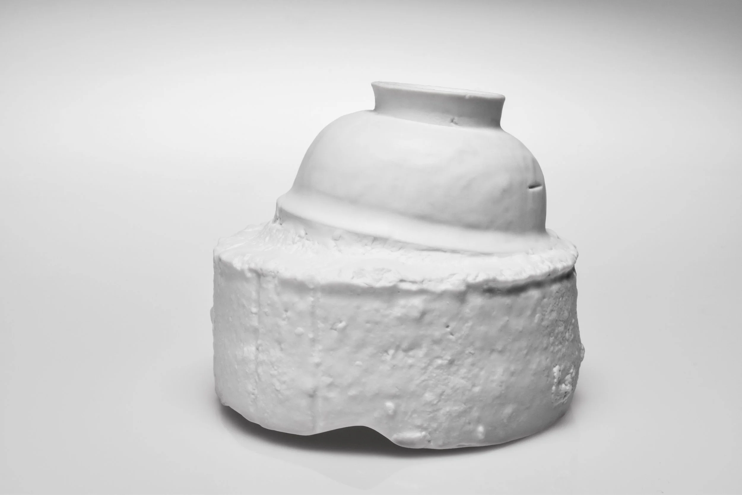 Saggar | Form Series , Jindezhen Porcelain with Glaze. 2017 - on going Ming Dynasty collapsed saggar and porcelain forms were collected from various sites around Jingdezhen, China, and moved through the mold making process; cast as thin porcelain versions of their former selves. Shifting form to surface, these objects touch lightly towards ideas related to dislocation, longing, and the inescapable potential of the cast off. Collapsing time and place, their glazed interiors seek to reanimate the objects as functional vessels of the present.