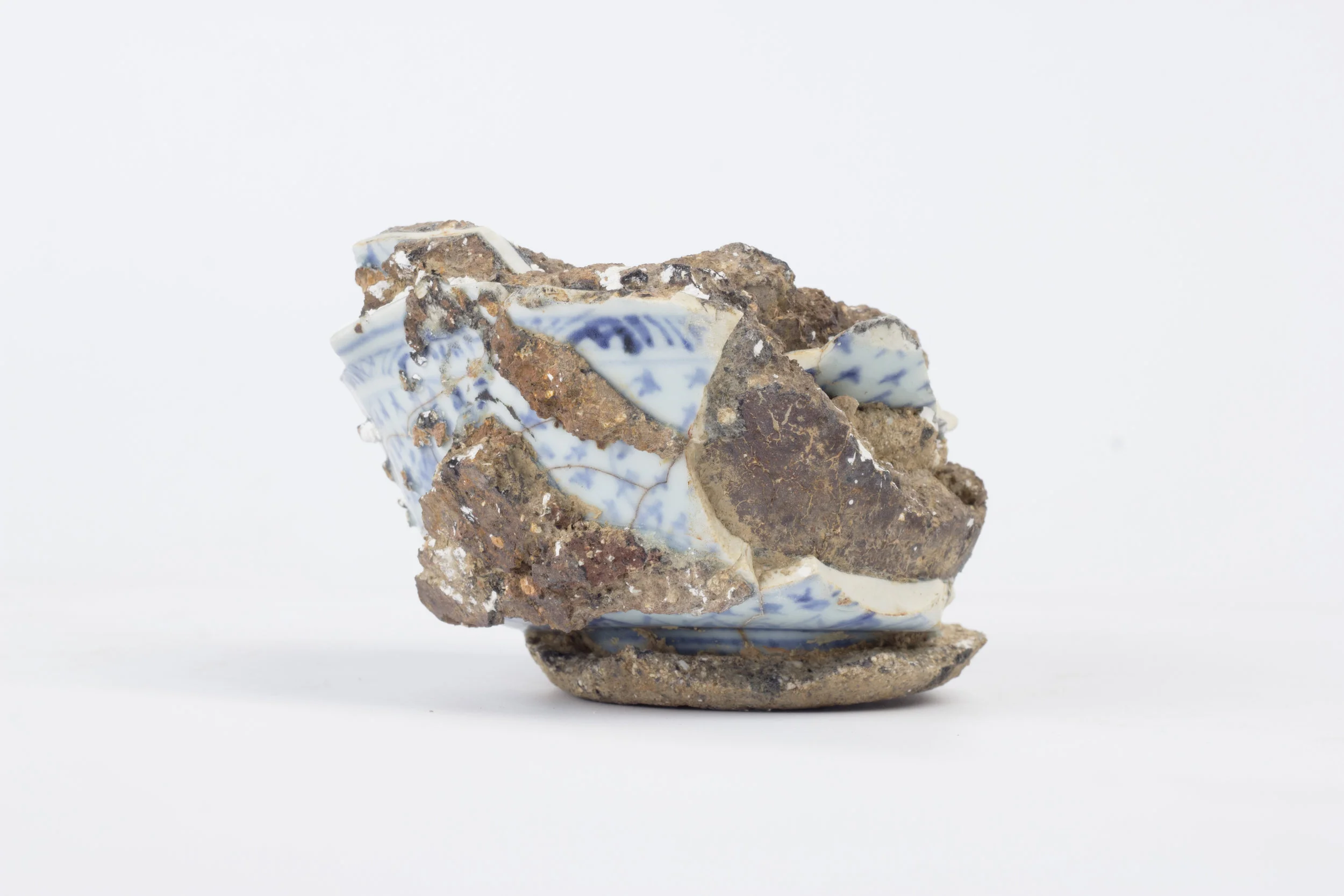 Saggar | Form Series , Found Ming Dynasty Saggar and Porcelain. 2017 - on going Ming Dynasty collapsed saggar and porcelain forms were collected from various sites around Jingdezhen, China, and moved through the mold making process; cast as thin porcelain versions of their former selves. Shifting form to surface, these objects touch lightly towards ideas related to dislocation, longing, and the inescapable potential of the cast off. Collapsing time and place, their glazed interiors seek to reanimate the objects as functional vessels of the present.