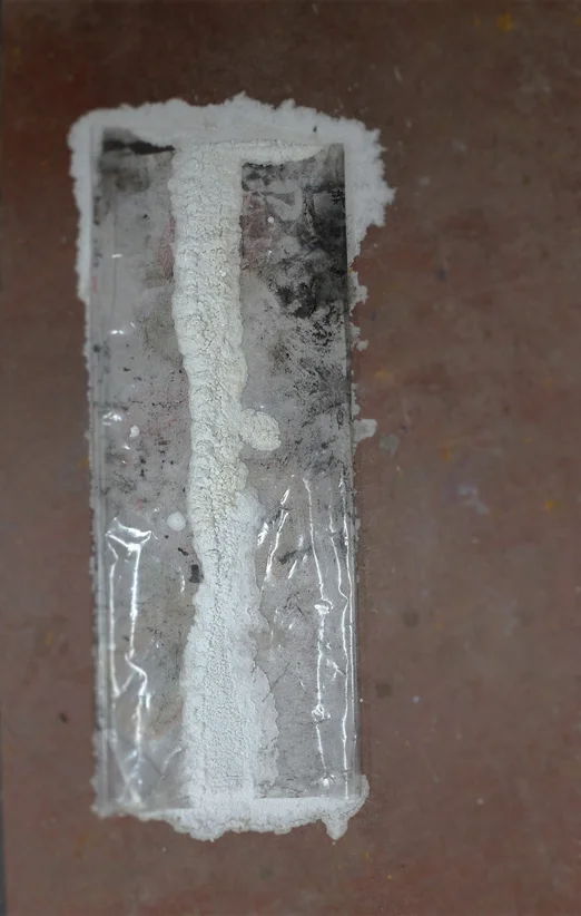   Archaeological textiles , found children’s towel, seawater, sand, salt and found plastic, 80 x 30 cm.&nbsp;  Residency view, NES, Skagaströnd (IS), April-May 2016.    