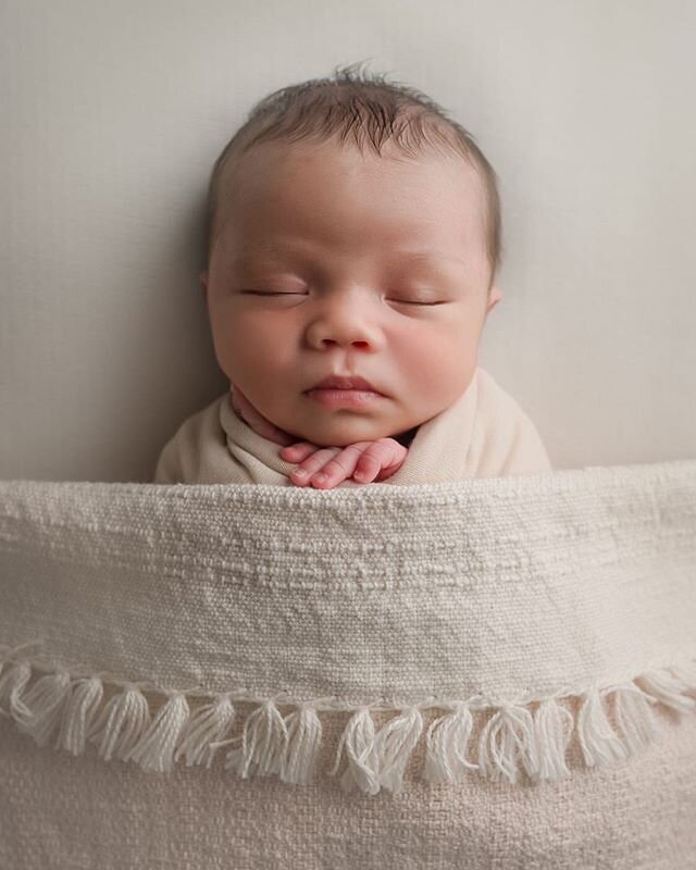 Another one of this cutie sleeping soundly in her handwoven blanket.