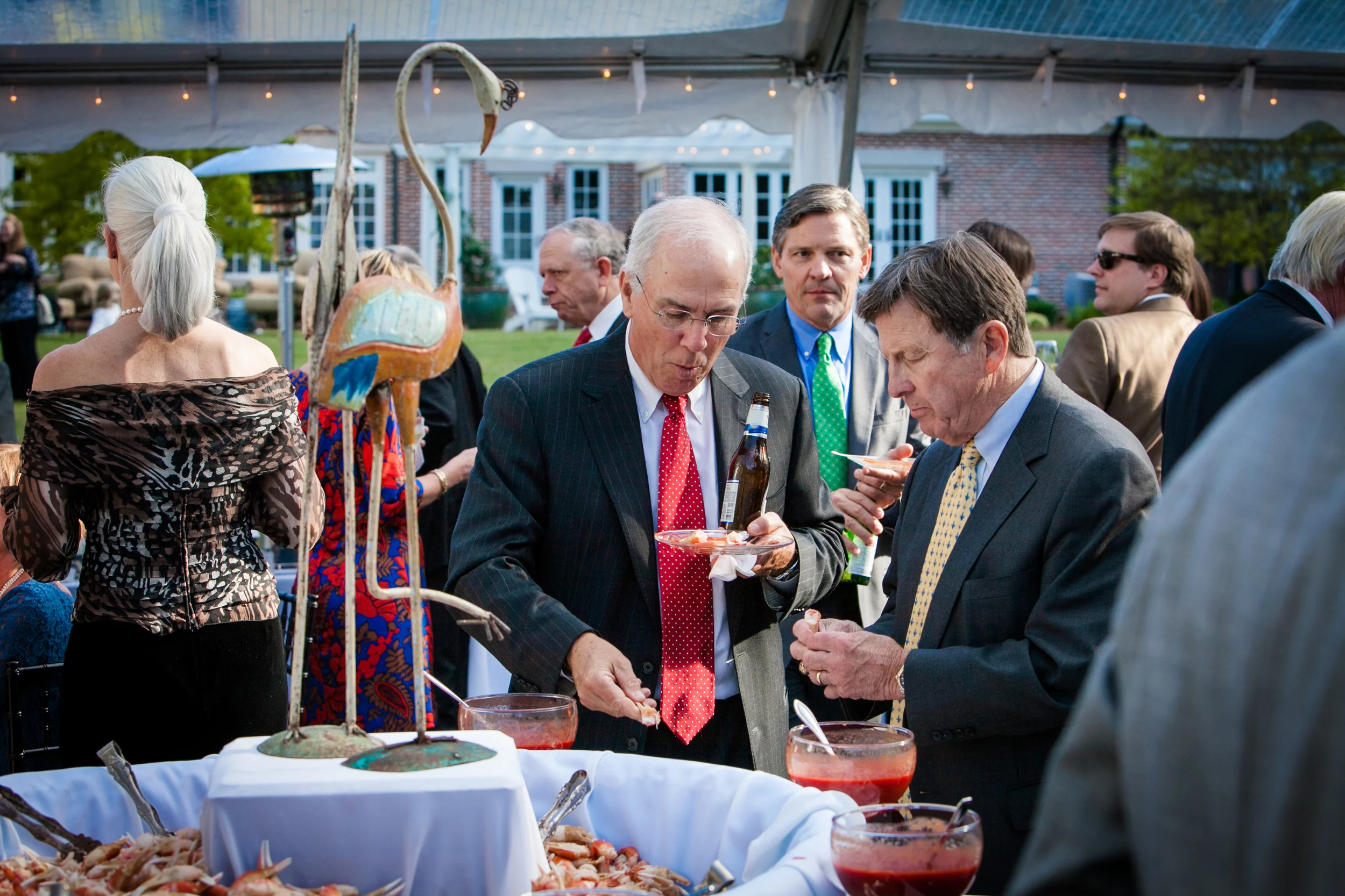Pair of cranes watch over boiled shrimp and Imperial crab claws