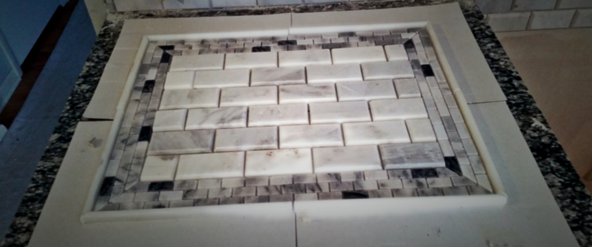 Setup for a center accent on a kitchen backsplash.