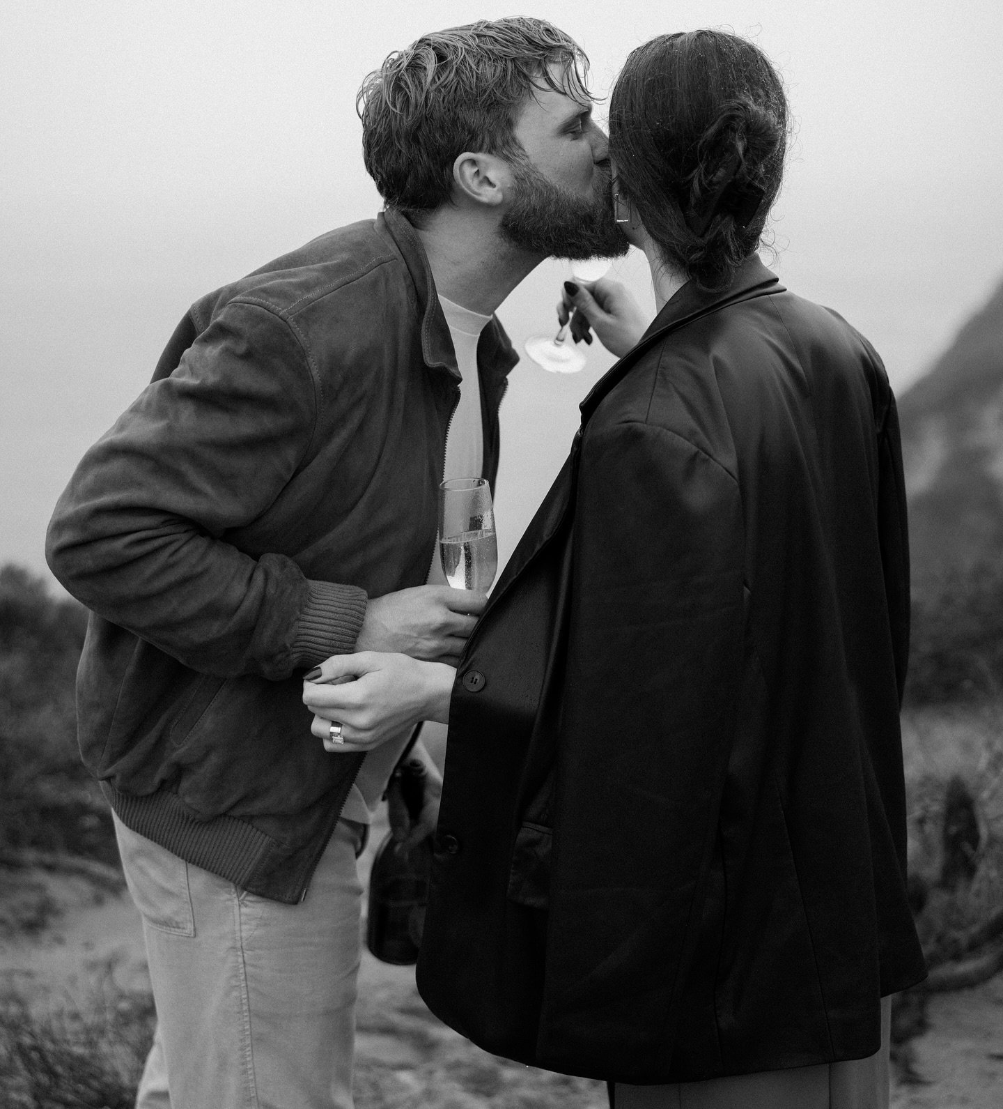 The most magical cliff side proposal in the pouring rain🖤 Tanner surprised Ali on a morning walk in Malibu &amp; asked her to marry him with their little dog ducky along for the ride. The rain made it feel like a literal movie scene + it was so spec
