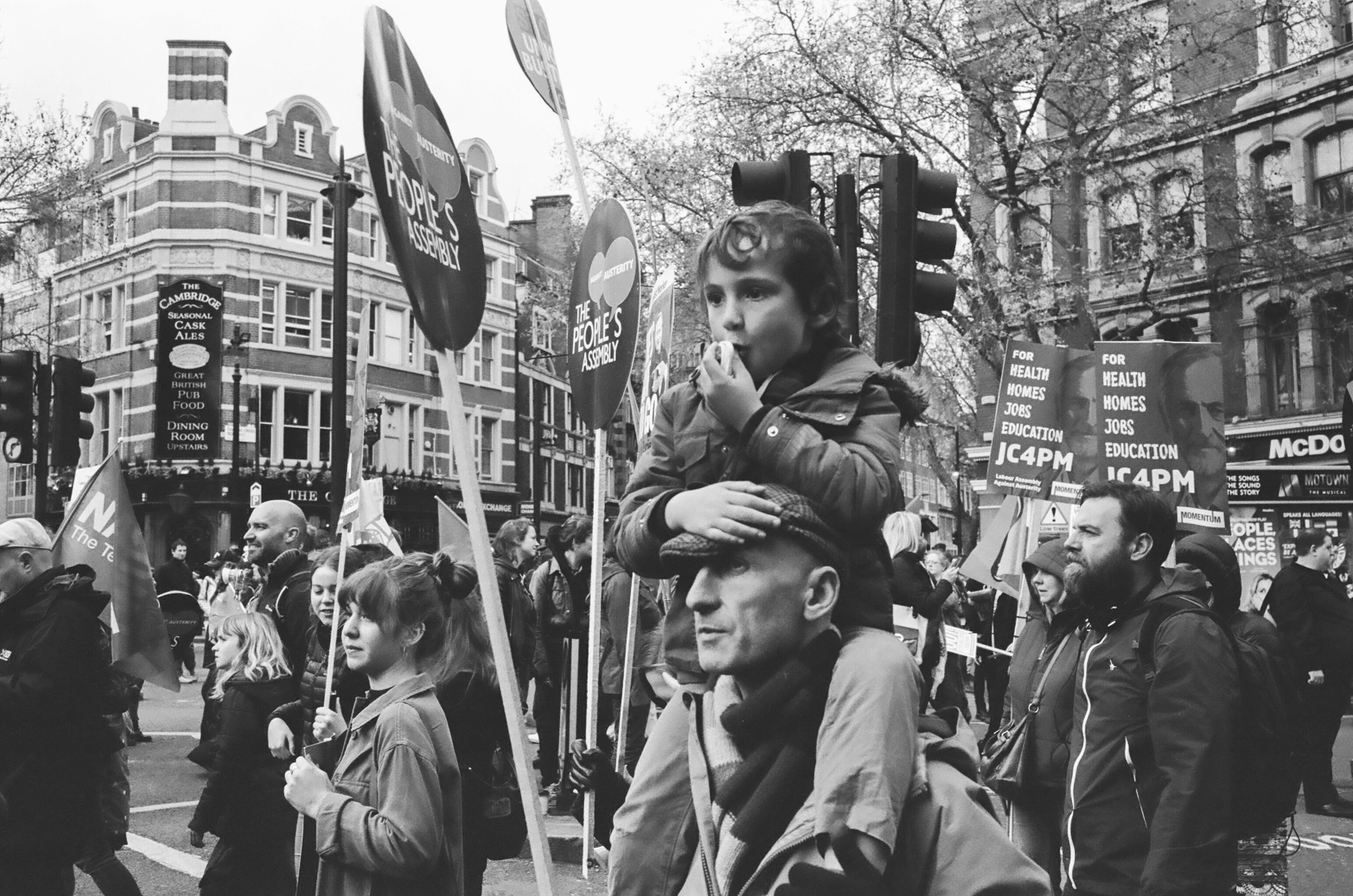 A young demonstrator joins the procession - Clifford Darby 2016