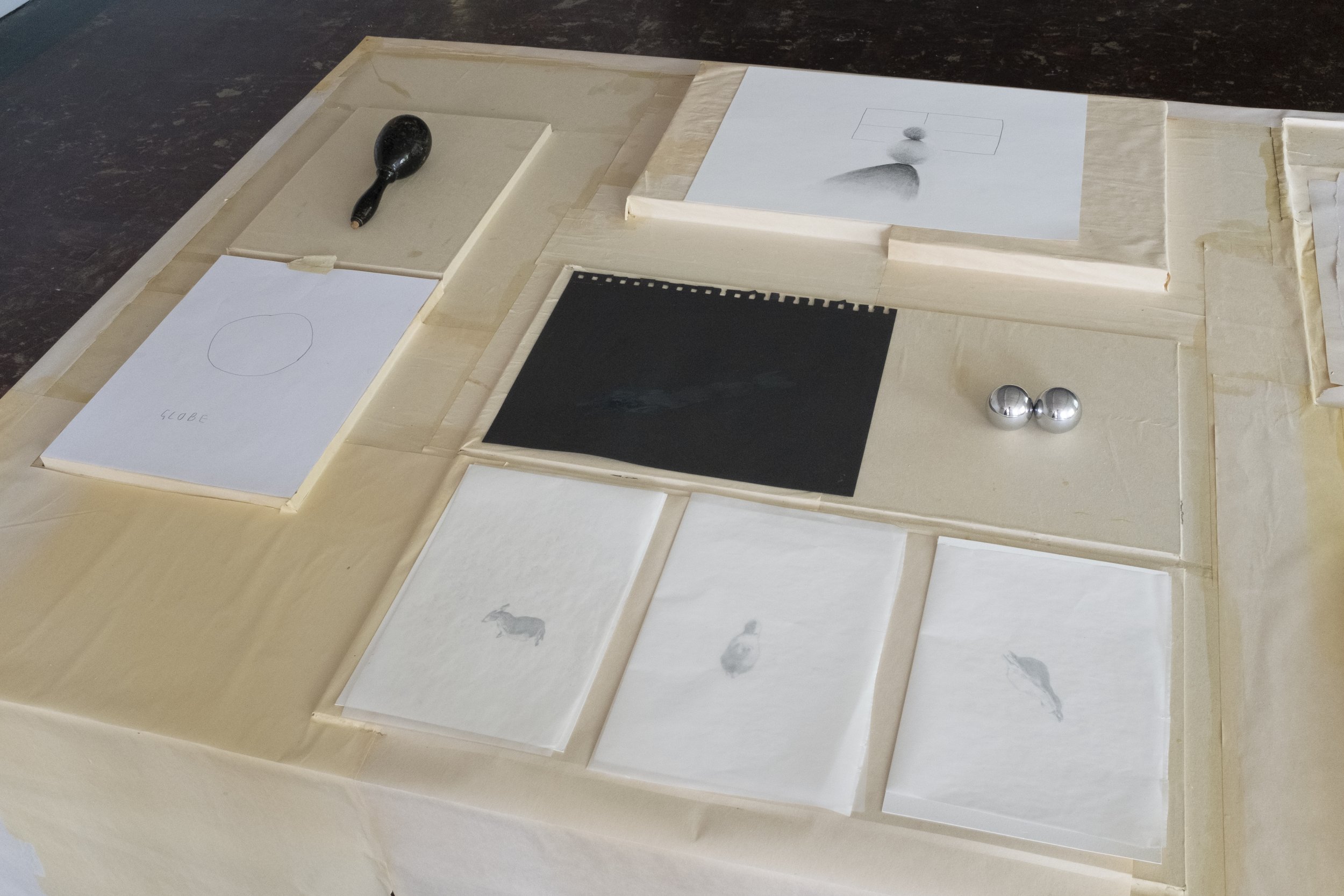 Table, oxidized packing paper, glue, foam, found objects, charcoal, graphite, wax paper, tape. Studio courtesy Summer Studio Grant from the Anderson Gallery in Richmond, VA.