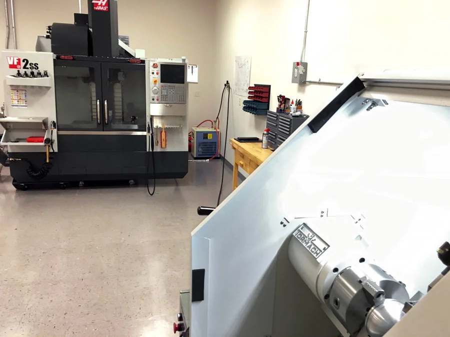 Tormach 15L Slant Pro with Haas VF-2SS in the background