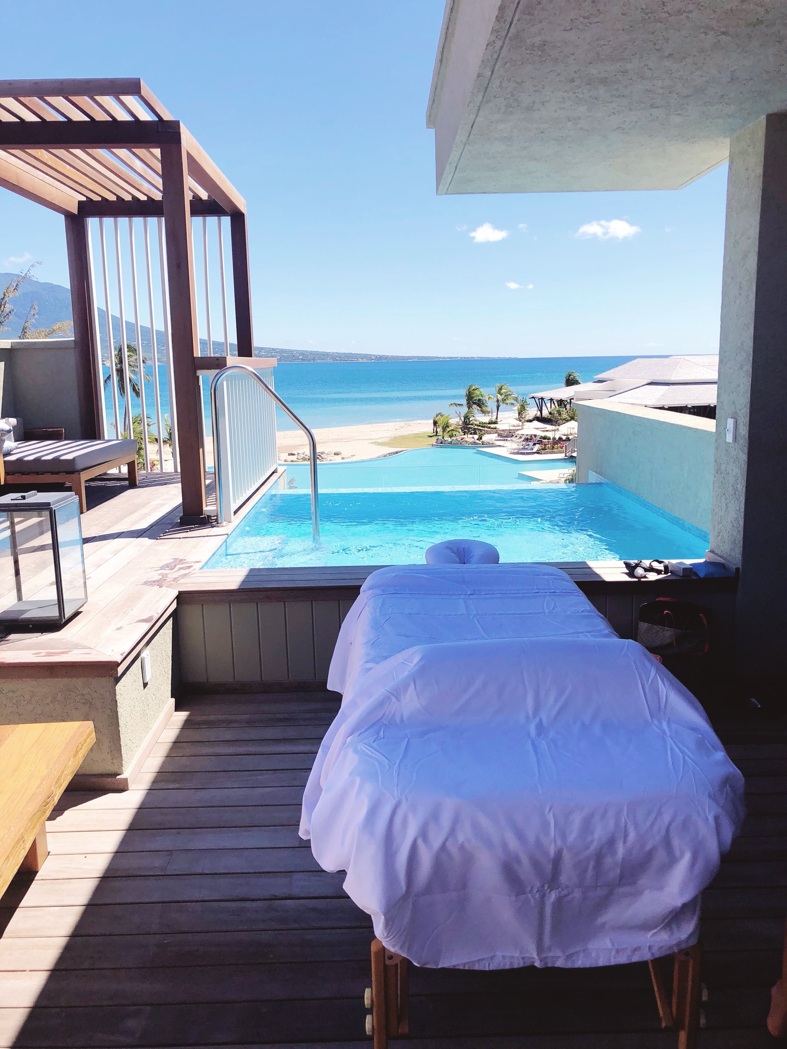 A local massage therapist who came to the hotel and set-up a table directly on our balcony. see below.