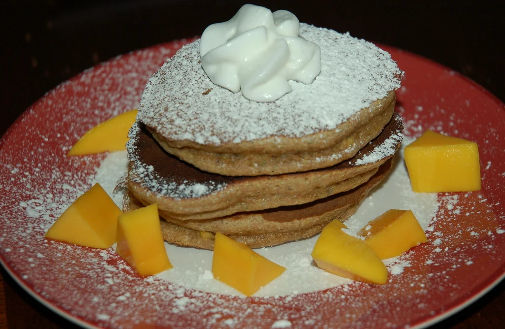 Spelt-Pistachio-Cardamom Pancakes with Mangoes and Cream