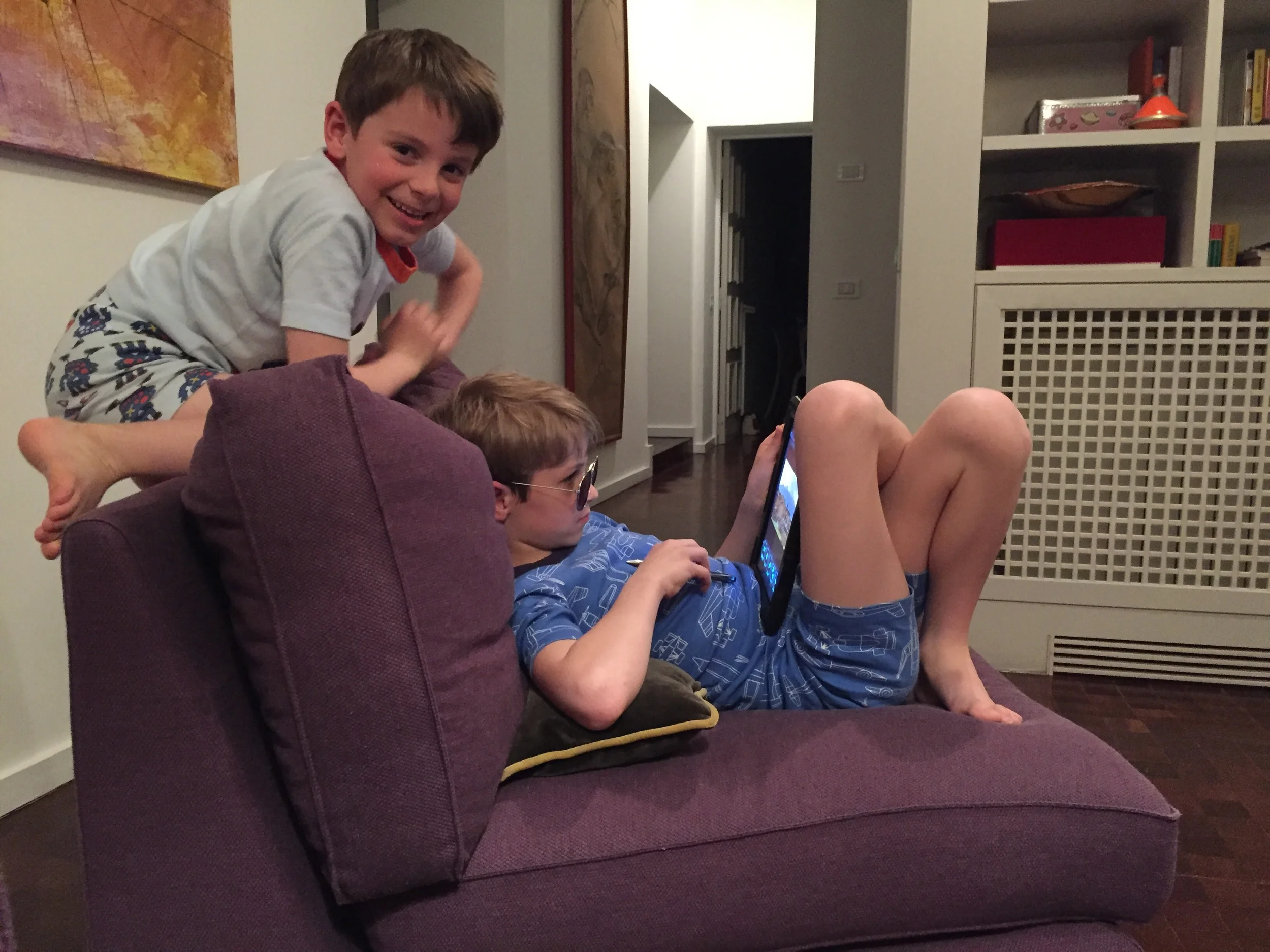 A brother and an 80s poser share an iPad in an Italian apartment.