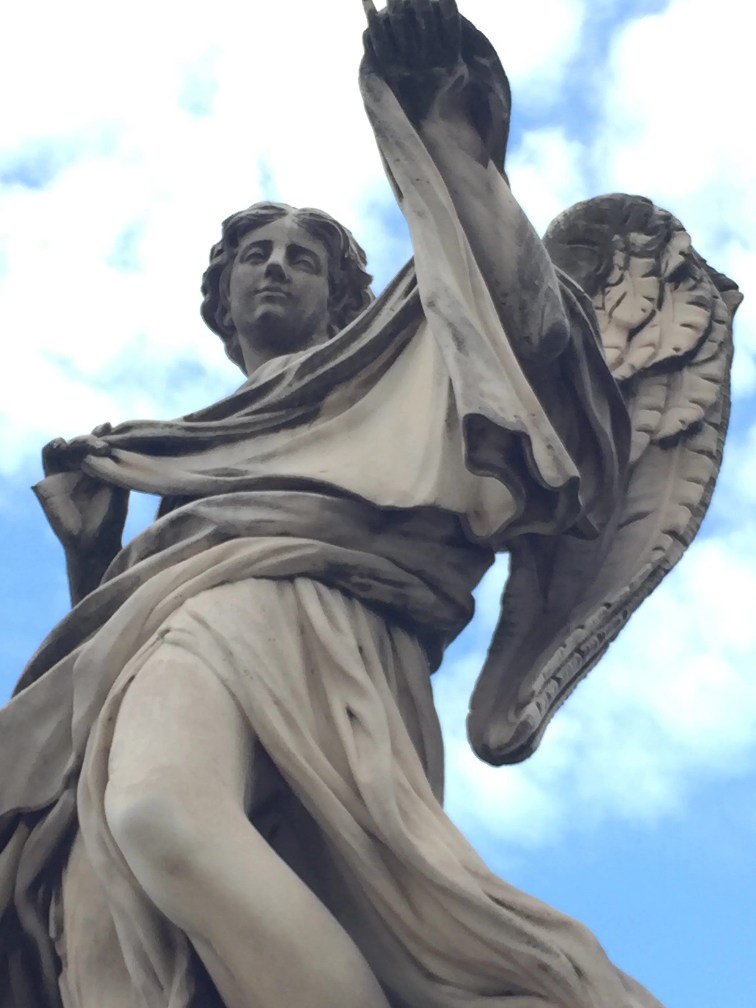 A statue on a bridge to Castel St. Angelo