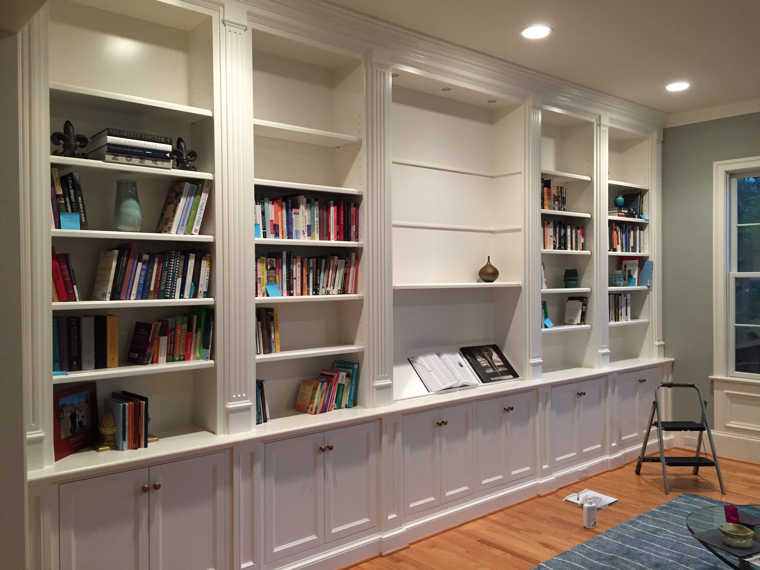 OMG, I feel SO lucky. We weren't really supposed to put anything on the shelves until Tuesday, but for the love of patience, we waited five whole days and the paint has simply got to be hard enough by now. It's going to be so much fun to fill these.