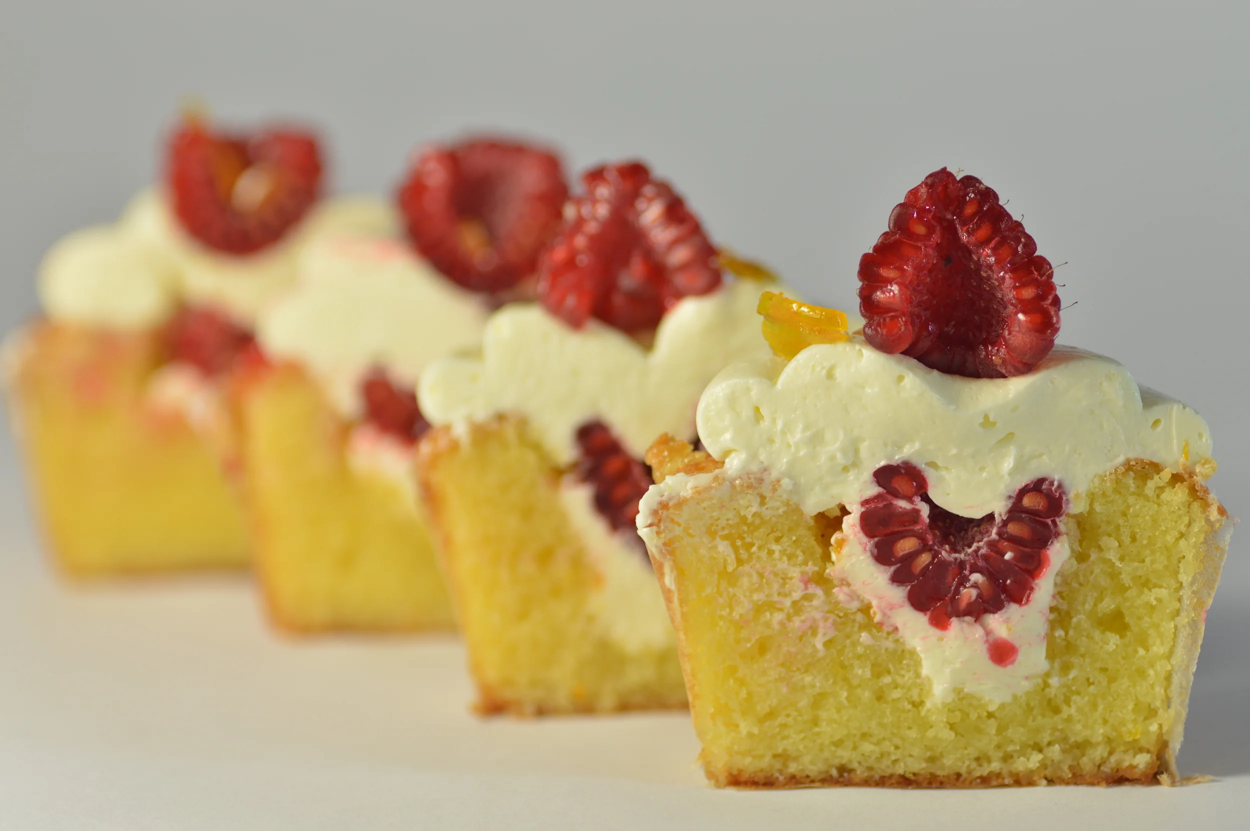 Almond cake scented with orange and frosted in white chocolate buttercream