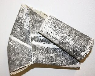 Land Shard 32011, sumi ink, glue on canvas remnant, folded and rolled3 1/2" x 4"