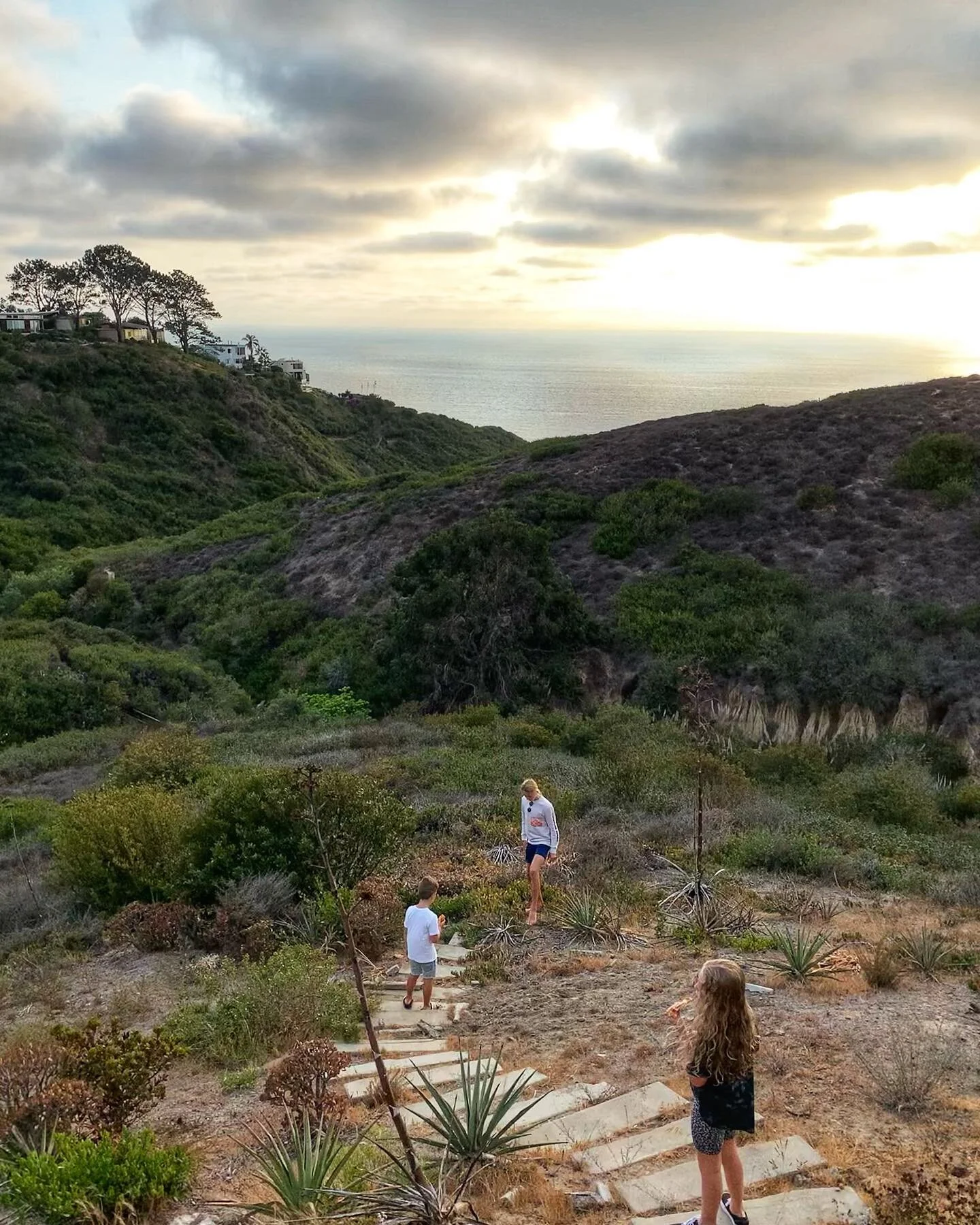 Darkened freckles,
Sun-kissed cheeks,
Fresh tan lines on salty skin.
Specs of sand underneath your nails,
Wet hair drying with the windows rolled down.
Cold, outdoor showers on sun-baked skin, crunchy footsteps walking home,
Soft, cozy sweatshirts on