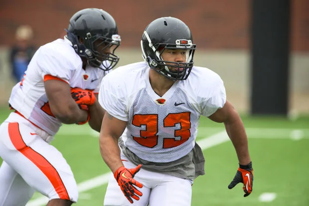 Damien Haskins Carries the Ball in Spring Practice.jpg