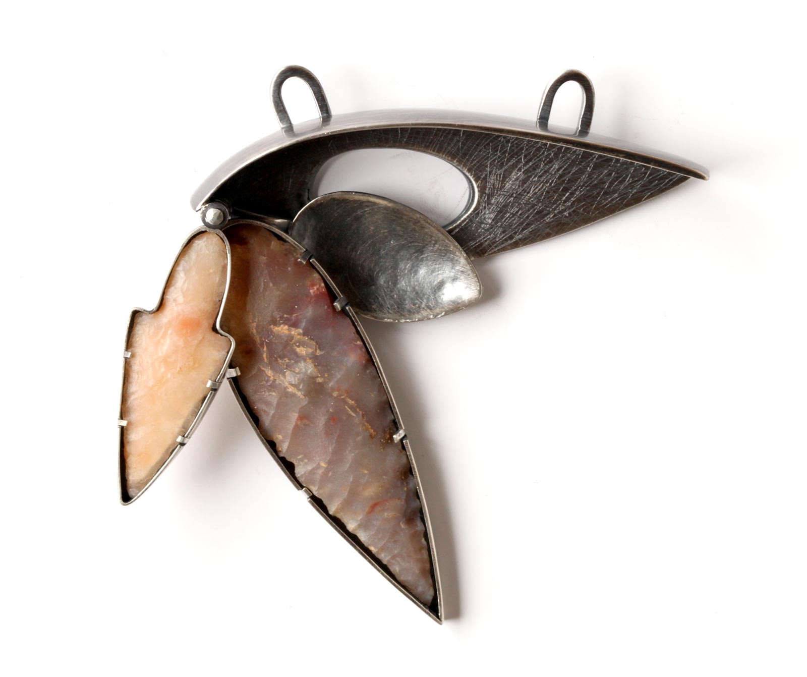VERSATILITY of silver, stone points and spoon, hinged allowing different positions when worn (like folding knives), 5.08 x 6.35 centimeters.
