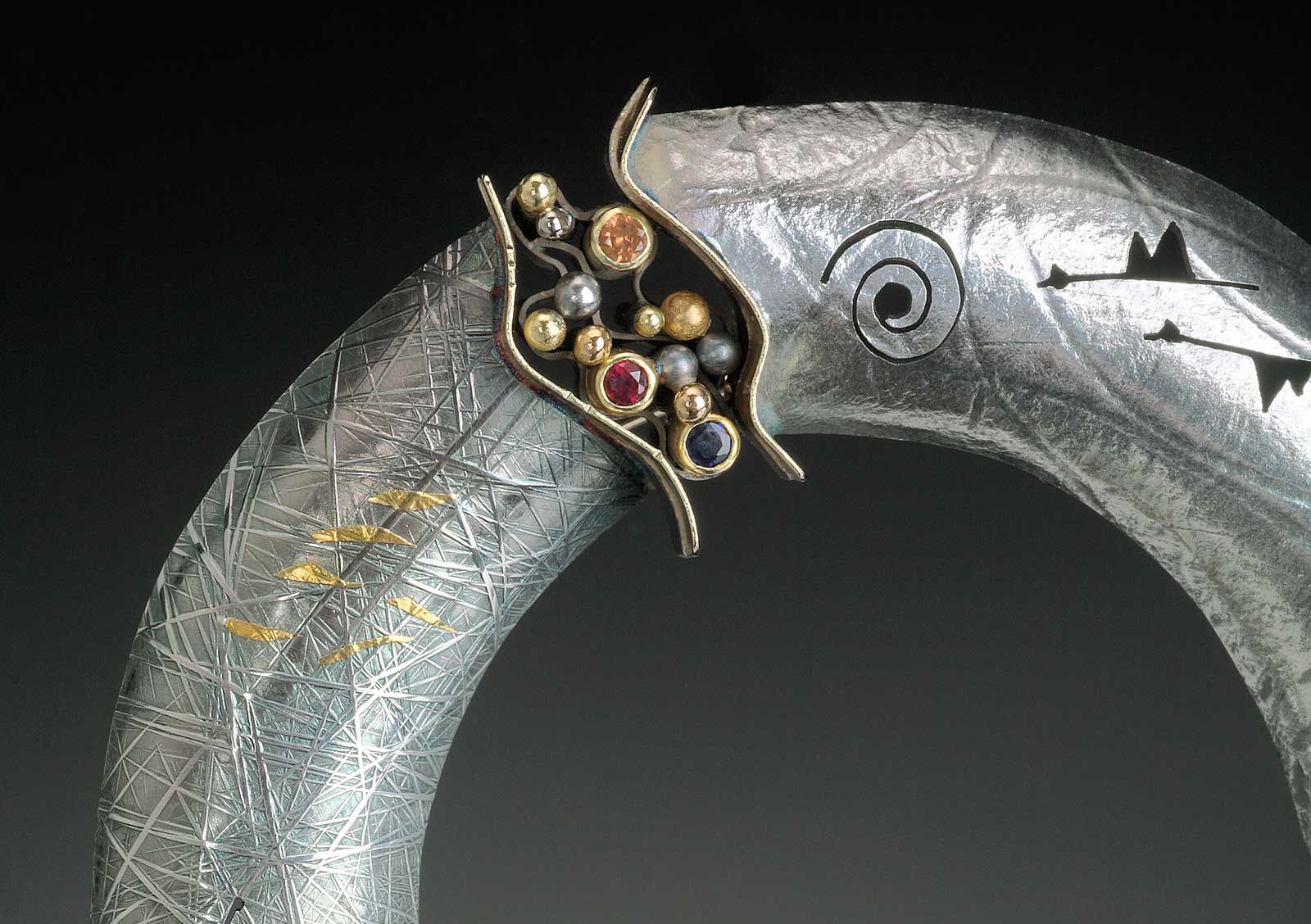 FEASTS OF TRADITION brooch/pendant of sterling silver, fourteen karat yellow, pink and palladium white gold, eighteen karat green gold, keum-boo, champagne diamond, red, blue, orange, and green sapphires, 6.99 x 6.03 x 1.27 centimeters, 2011.