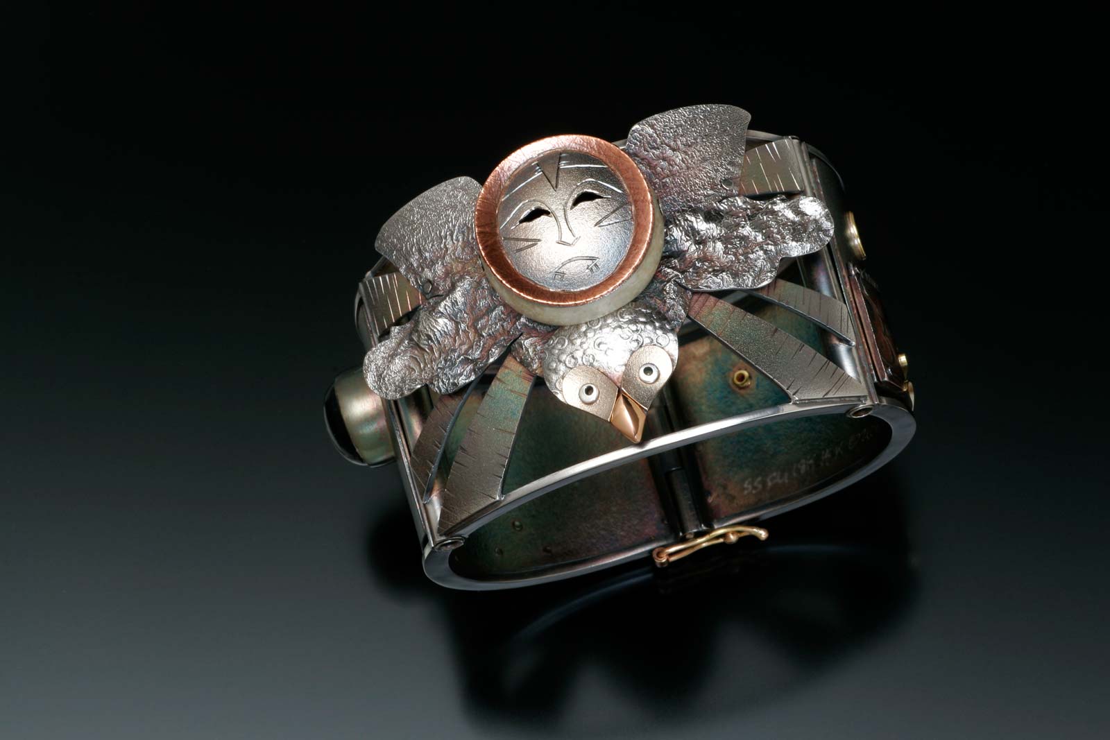 OWL MASK SPIRIT HELPER bracelet of sterling silver, fourteen and eighteen karat gold, mokume gane, 4.13 x 6.99 x 6.67 centimeters, 2008.