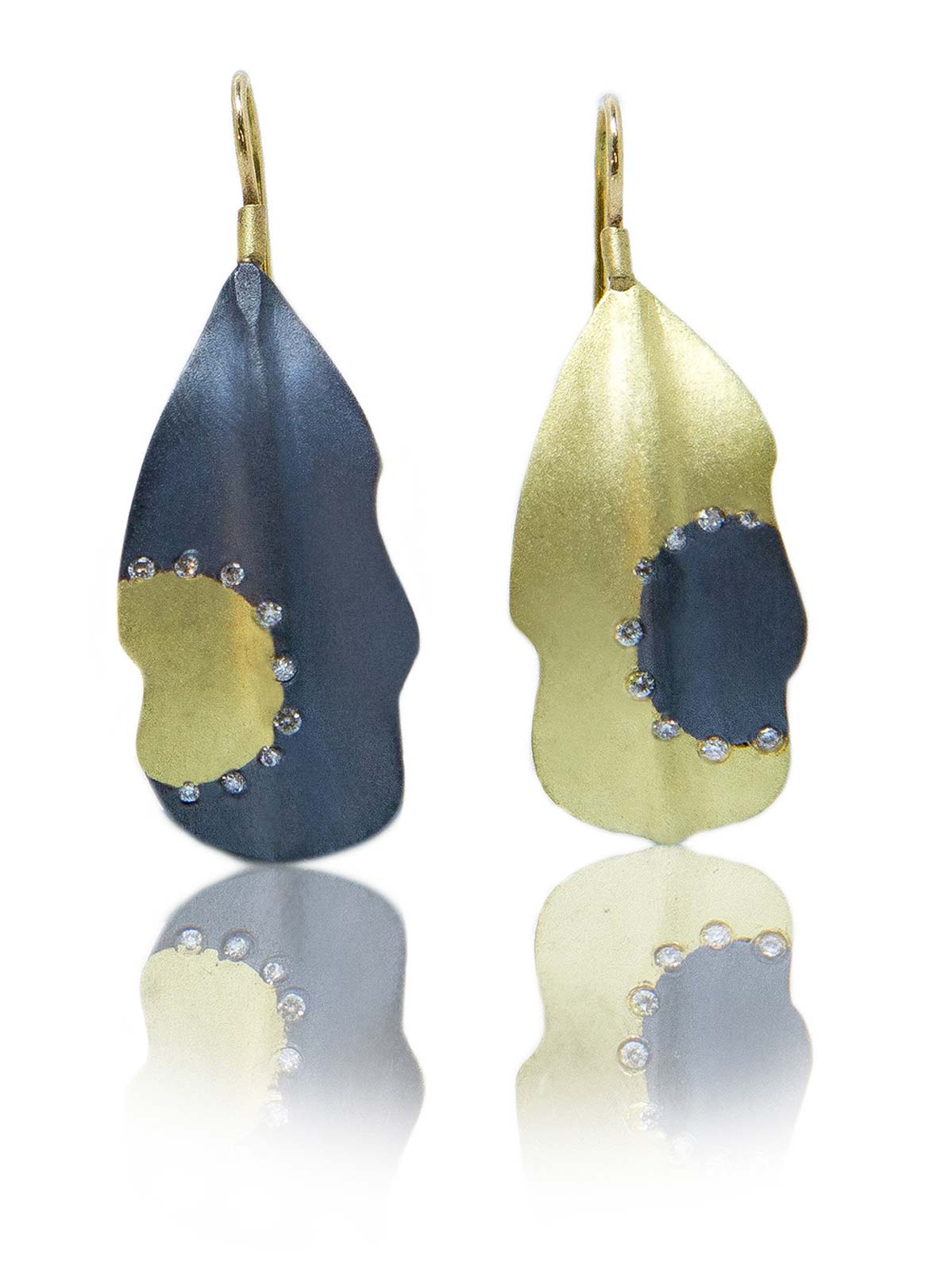 ASYMMETRICAL CACTUS LeAF EARRINGS of oxidized silver, eighteen karat gold, diamonds, carved, cast, 2014. Photograph by Shannon Partrick.