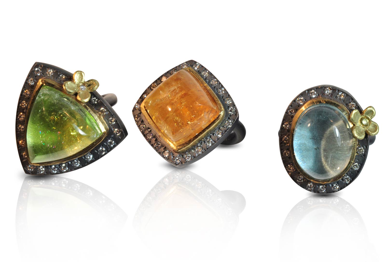 BARBIE DREAM HOUSE RINGS of mandarin garnet, beryl, aquamarine, oxidized silver, eighteen karat gold, diamonds, carved, cast, 2011. Photograph by Julieta Rivarola.