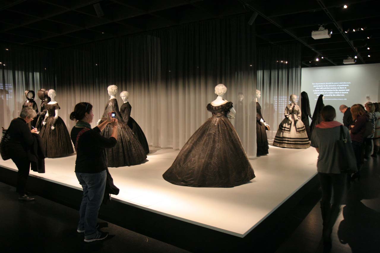 INSTALLATION VIEW OF “DEATH BECOMES HER: A CENTURY OF MOURNING ATTIRE,” at the Metropolitan Museum of Art, Anna Wintour Costume Center. The exhibition followed the period from the 1830s to 1915, when average life expectancy was less than fifty and death in childbirth or as a child was common. The ensembles ranged from states of full-mourning to that of half-mourning. Photographs by Carolyn L. E. Benesh/Ornament.