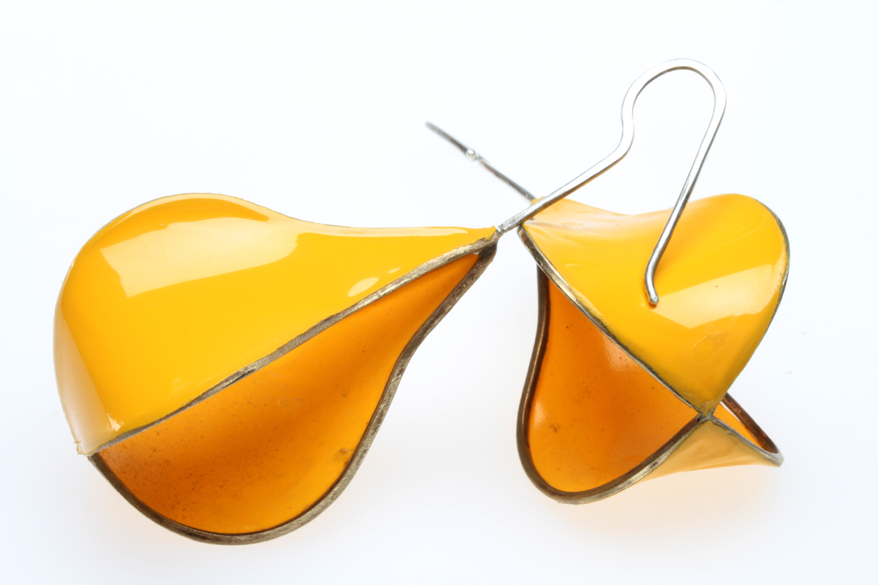 FINISHED FIG OR PEAR-SHAPED MATRIX EARRINGS, with only two of four sides covered. The Ultracote covering, while difficult to adhere, will heatshrink tightly, yielding these nice parabolic curves. Note that it is smoother than the unfinished earring, which had not yet been heated as much as this pair. Because both sides of the Ultracote are yellow, it gives the illusion that more than two sides are covered. I feel this design is the most successful application yet of heatshrinking, but it is difficult to execute successfully and repeatedly.