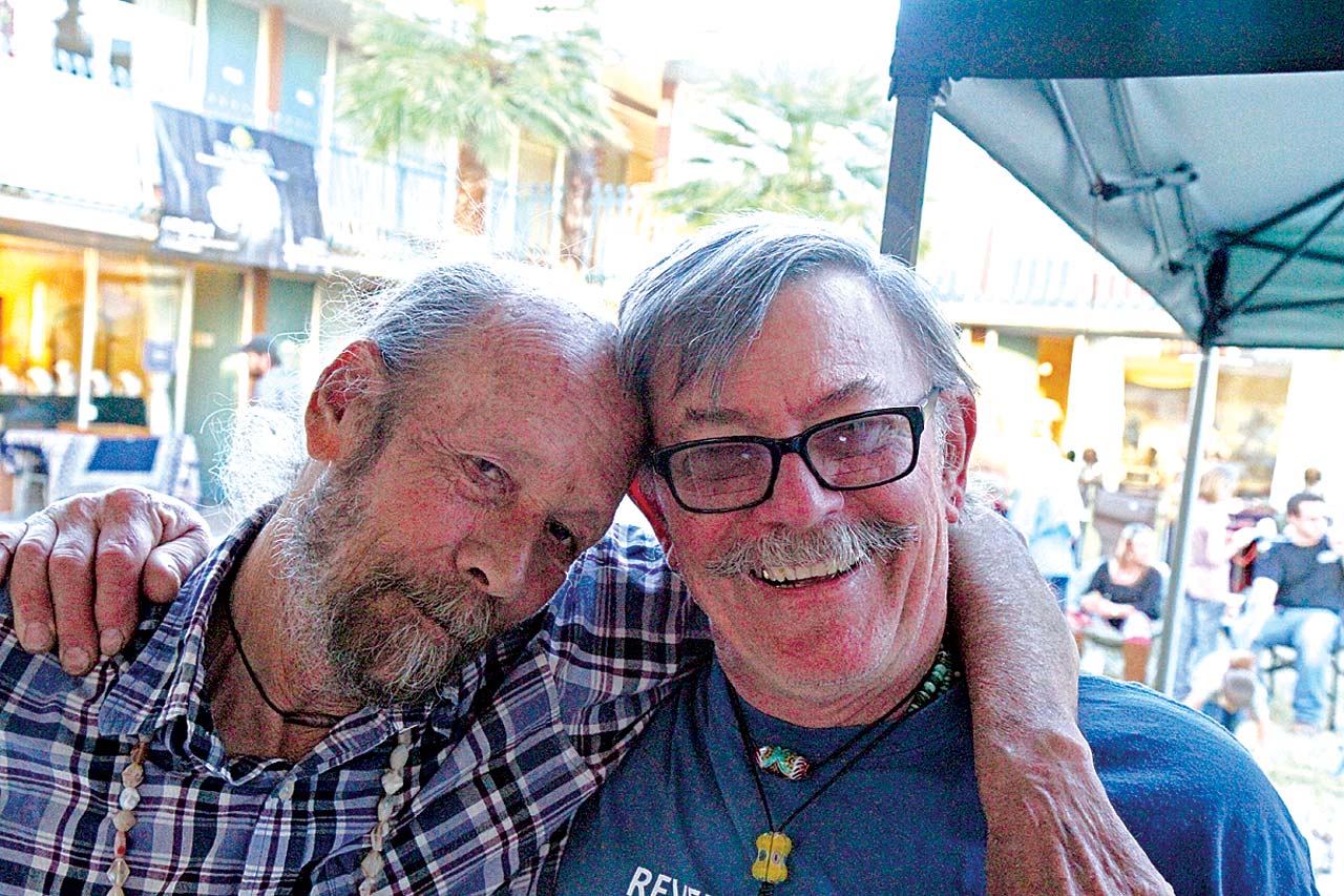 DANNY LOPACKI AND ART SEYMOUR, good friends and respectively noted stone carver and chevron glass bead artist. Lopacki’s booth shows both of their work, as well as other beads.