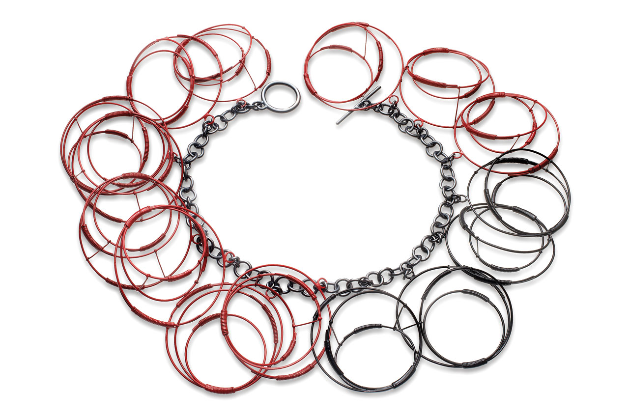RED/BLACK CIRCLES NECKLACE of sterling silver, steel, powder-coated, hand-fabricated, 45.72 x 7.62 X 2.54 centimeters, 2012.