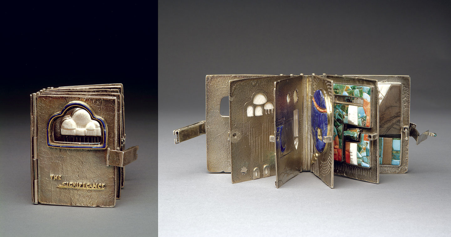 THE SIGNIFICANCE BOOK of silver and gold with turquoise, lapis lazuli, fossilized ivory, wood, coral, and other stones, fabricated, tufa-cast, 10.16 centimeters tall, circa 1980. Private Collection . 