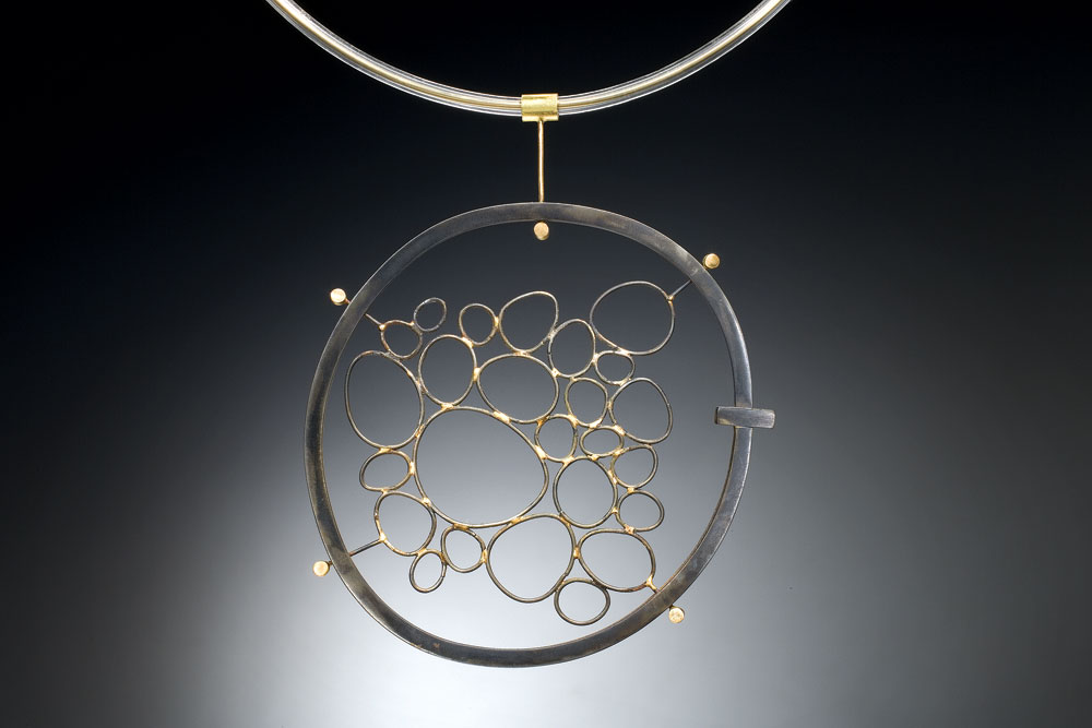 FORGED CIRCLES NECKLACE of steel, eighteen karat gold, PVC, forged, 10.16 x 9.53 x 1.27 centimeters, 2002.