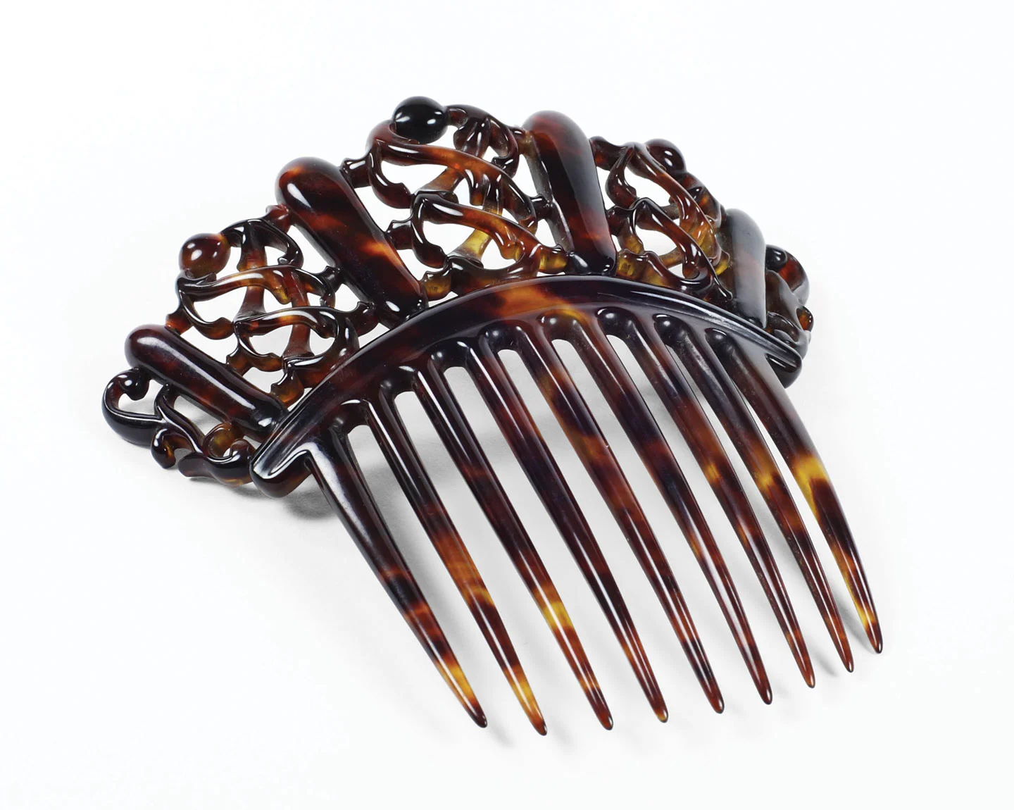 CELLULOID COMB, English, circa 1880s. “Hair jewels” like this celluloid comb were popular gifts from husbands to wives however they were highly flammable.