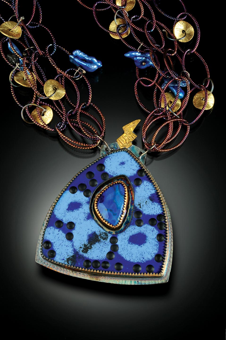 NECKLACE of sterling silver, twenty-two karat gold, faceted lapis and enamel; pendant 3.81 x 5.08 centimeters; necklace 55.88 centimeters long, 2015. “The lightning bolt on top reaching to the sky was my inspiration.”