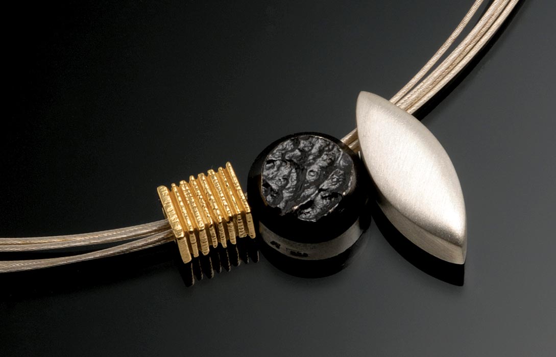 BLACK & WHITE COLLECTION ELEMENTS of eighteen karat yellow gold and sterling silver set with natural black jade and mother of pearl inlay, ranging in size from .64 to 1.91 x .95 centimeters, 2006.