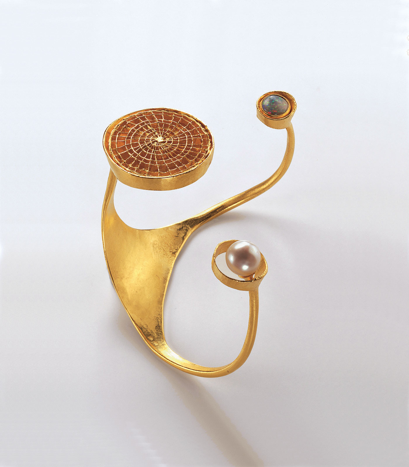 WILHELM BUCHERT BANGLE of gold, opal and pearl, 1969. Collection of Schmuckmuseum Pforzheim. Photograph by Rudiger Floter.