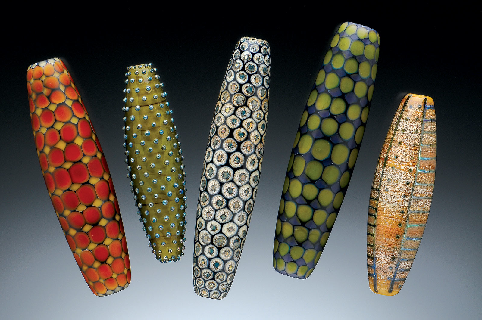 COLLECTION OF TOTEM BEADS of flameworked glass, largest bead 10 centimeters long, 2000-2003. Photograph by Dean Powell.
