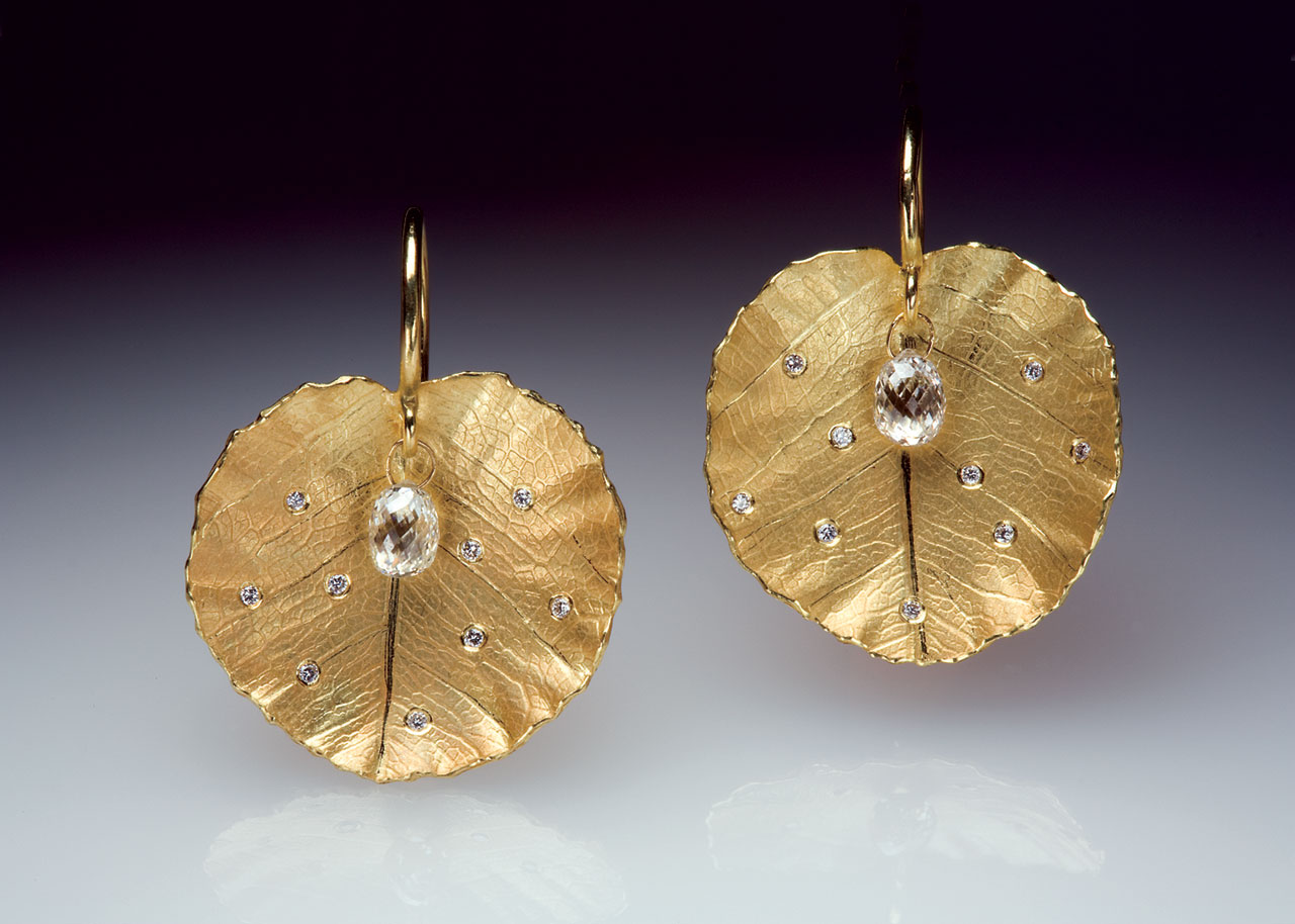 LOTUS LEAF EARRINGS of eighteen karat gold, diamond briolette drops, and diamonds, 2008. Photograph by Tim Callahan.