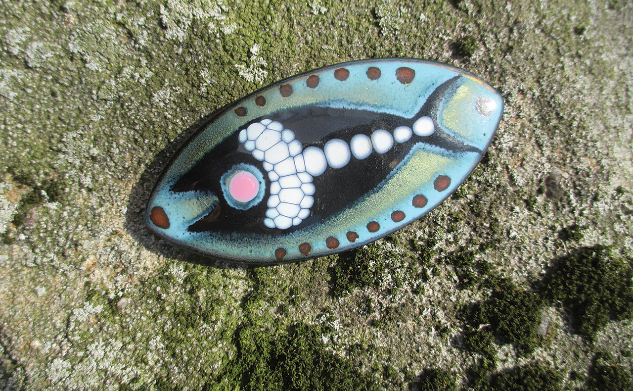 FISH BROOCH/PENDANT, 7.78 x 3.81 centimeters, paper label on back marked “VIRGINIA DUDLEY.”