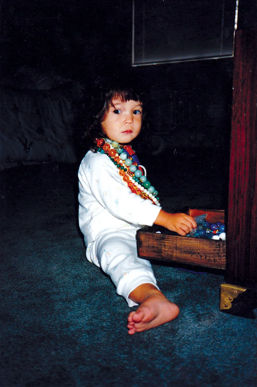 GENEVIEVE YANG breaking into her mother’s jewelry box, Palo Alto, California, 1988.