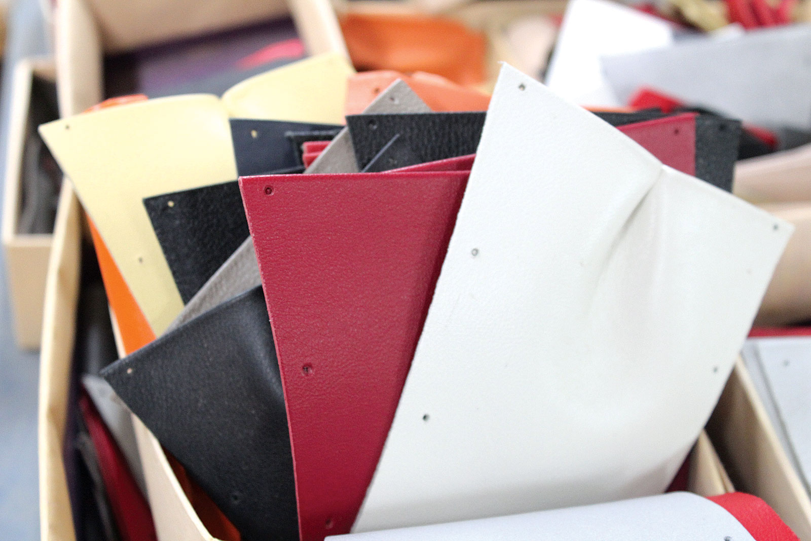 LEATHER GUSSETS . These parts have been cut, glued and punched with holes corresponding to the metal parts where they will be attached with rivets. Photograph by Dariel Benton-Updike. 