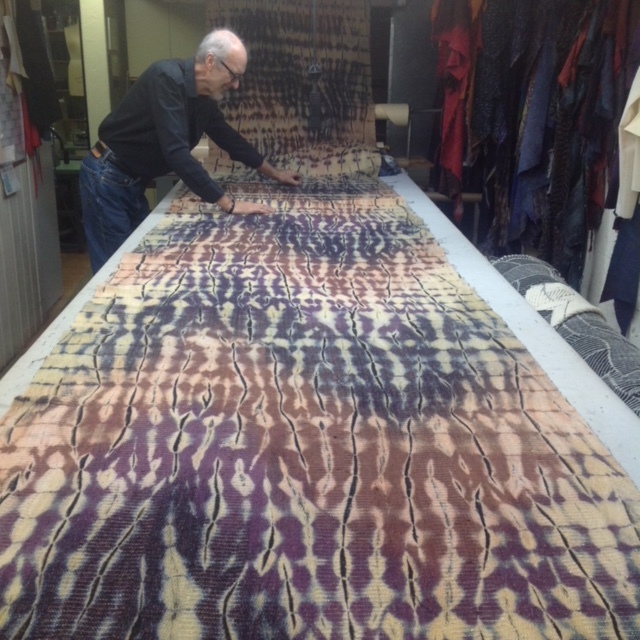 Rodger Footitt cutting wafts of shibori-dyed silk.