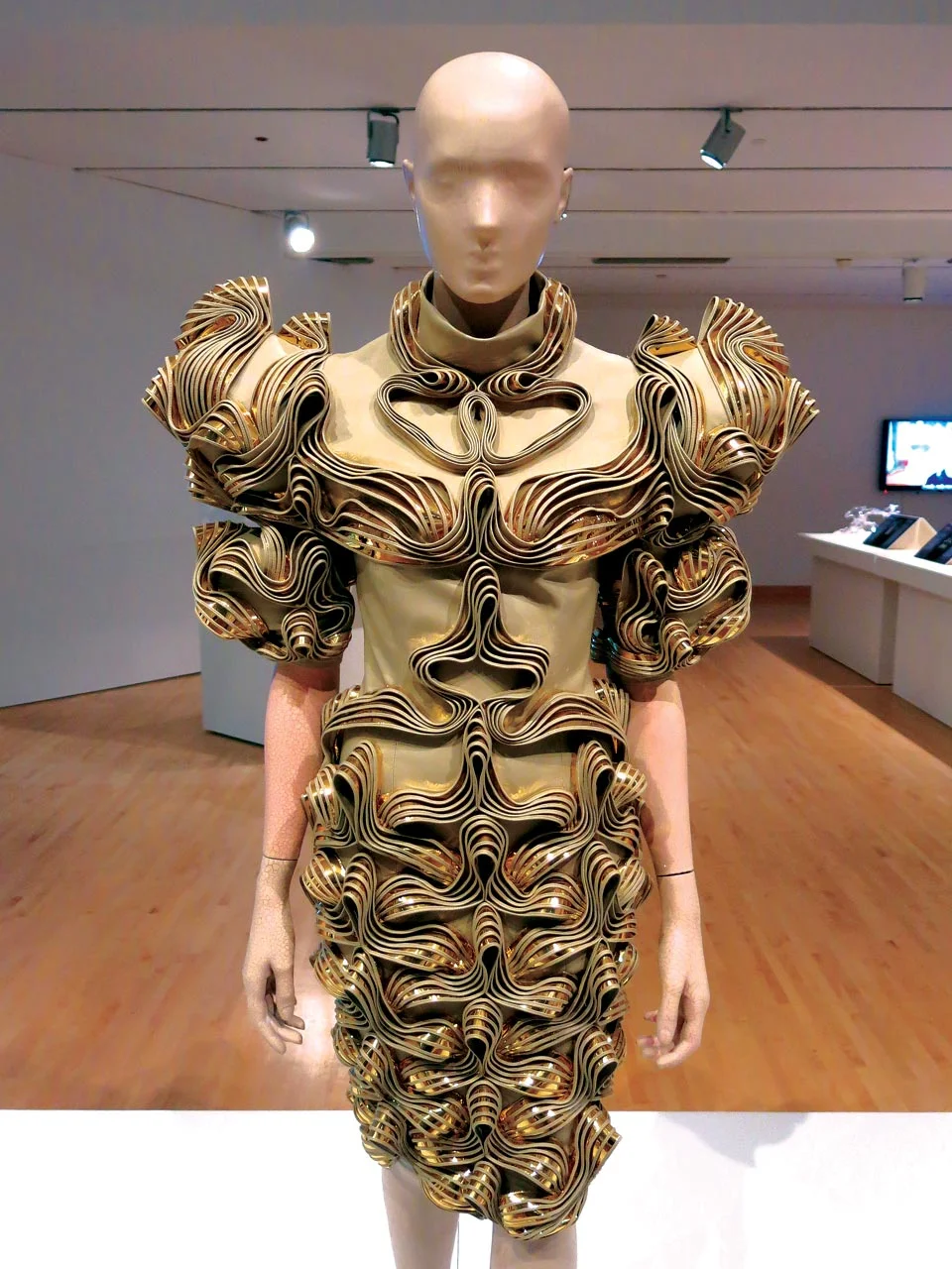 RADIATION INVASION DRESS from 2009 collection of faux leather, gold foil, cotton, and tulle. Photograph by Patrick R. Benesh-Liu.