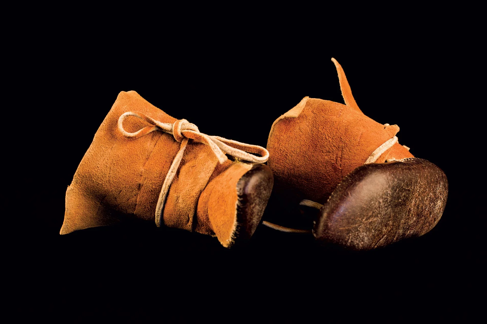 BOY’S MOCCASINS by Santiago Romero (Jemez) of leather, sinew, vegetal dye, 1950s.