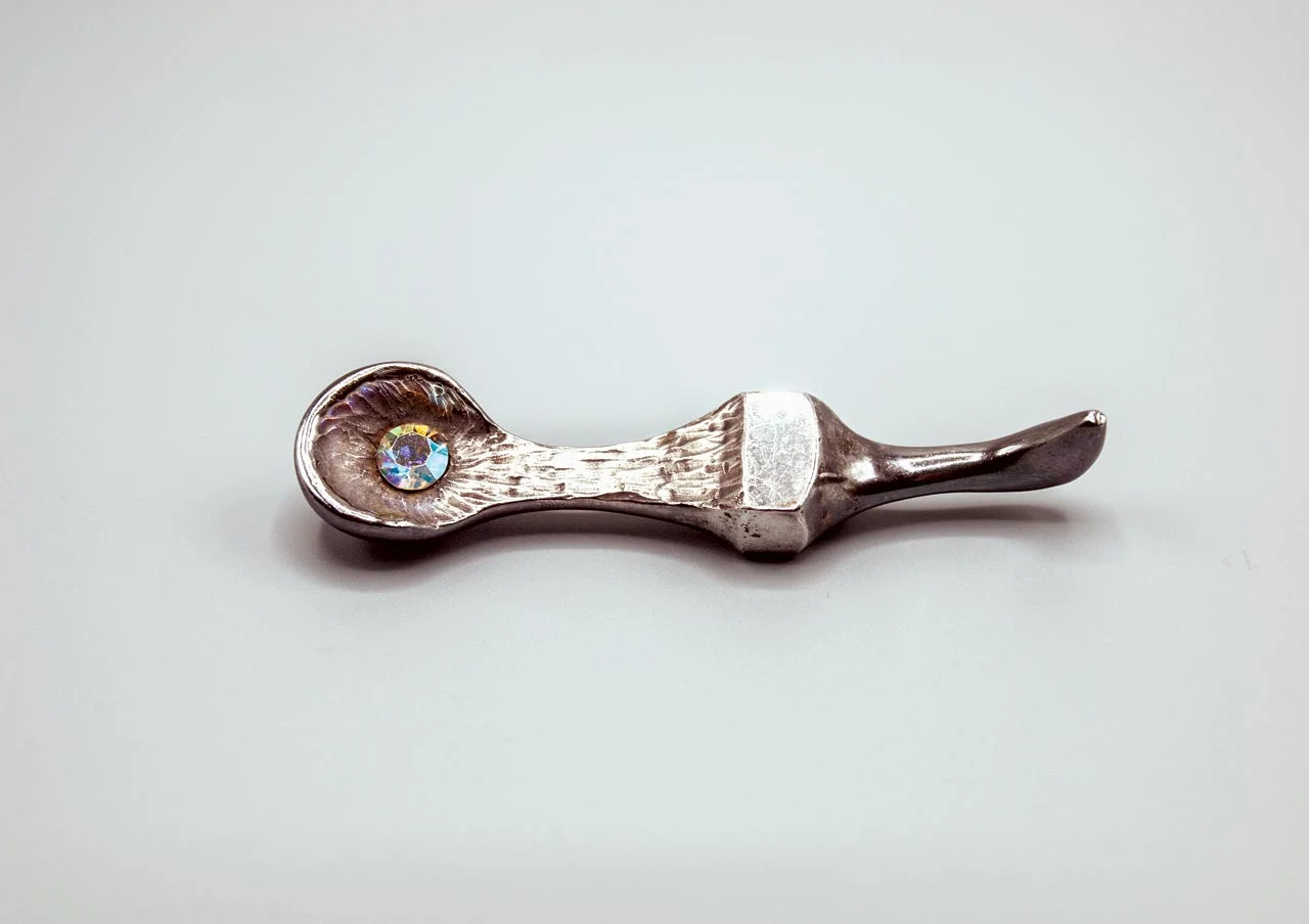 BROOCH of sterling silver and rhinestone, 2.5 x 4.8 x 1.6 centimeters. Collection of Janet Sanderson Johnson. Photograph by Demitra Thomloudis.