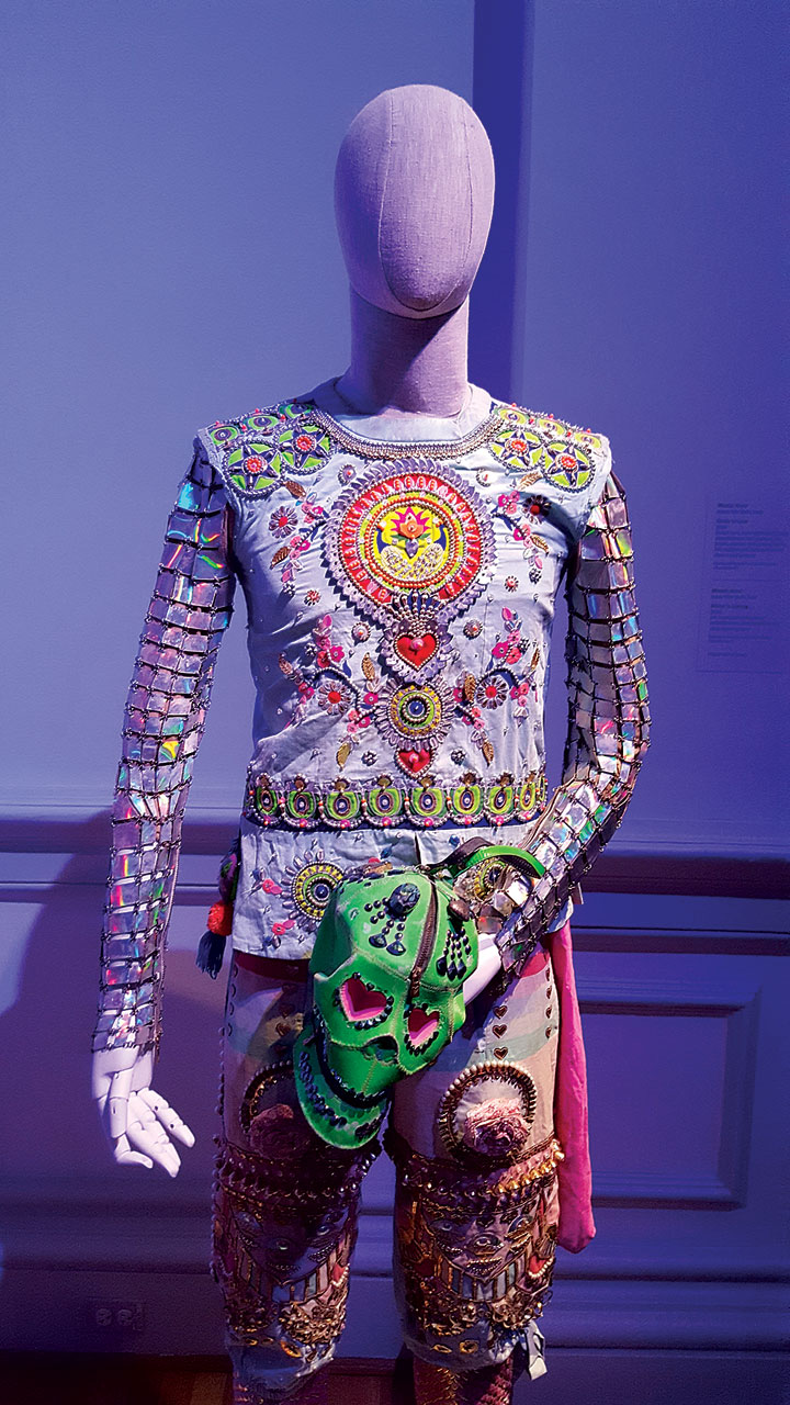 READY TO LOVE ENSEMBLE by Manish Arora of thread, silk, beads, crystals, faux patent leather, felt, sequins, and iridescent armor, hand-embroidered, hand-embellished, hand-appliquéd, chain-linked by hand, 2016. Photograph by Carolyn L.E. Benesh.